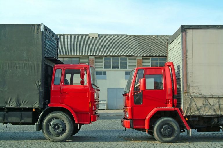 commercial delivery trucks parked face-to-face